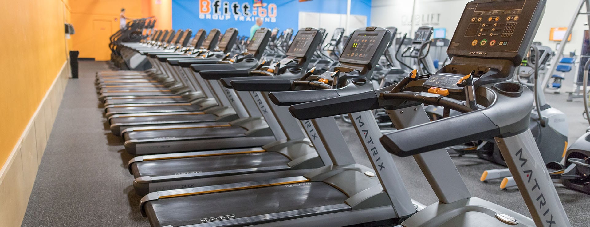 row of treadmills in gym near me