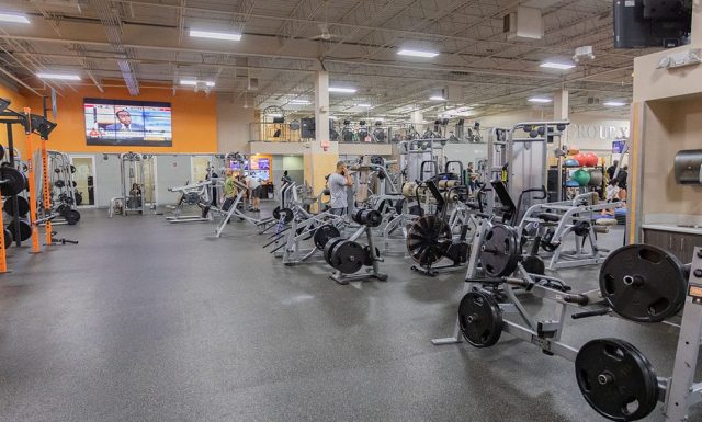 spacious strength training floor at modern gym