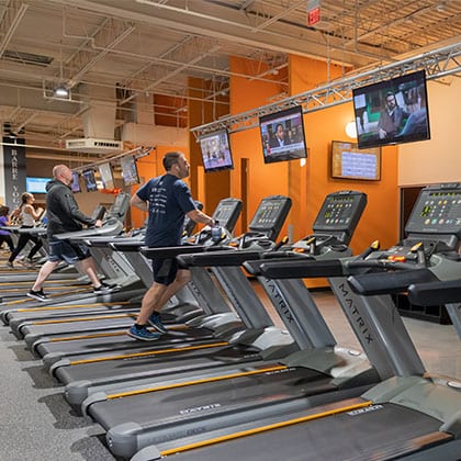 Gym members using treadmills