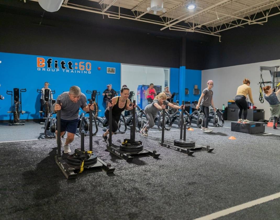 clean training studio with group fitness class in gym near me