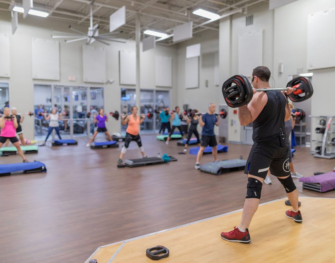 people working out in spacious group exercise studio at best fitness