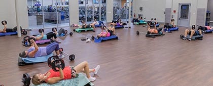 gym members working out in spacious fitness studio