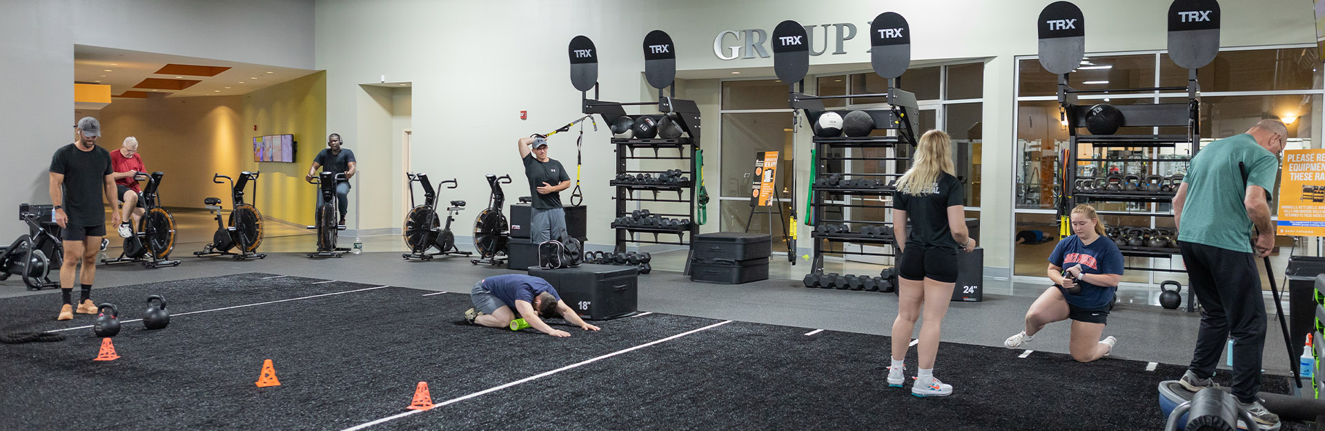 people using functional training equipment in a modern gym