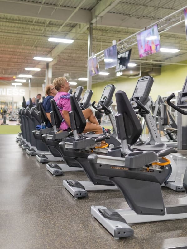 gym members use cardio training equipment for a circuit workout at best fitness nashua gym