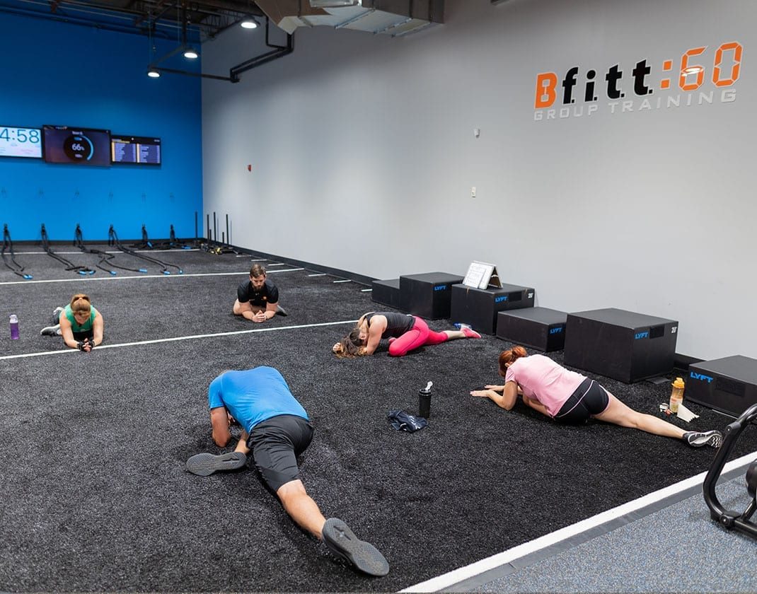 group stretching in spacious studio