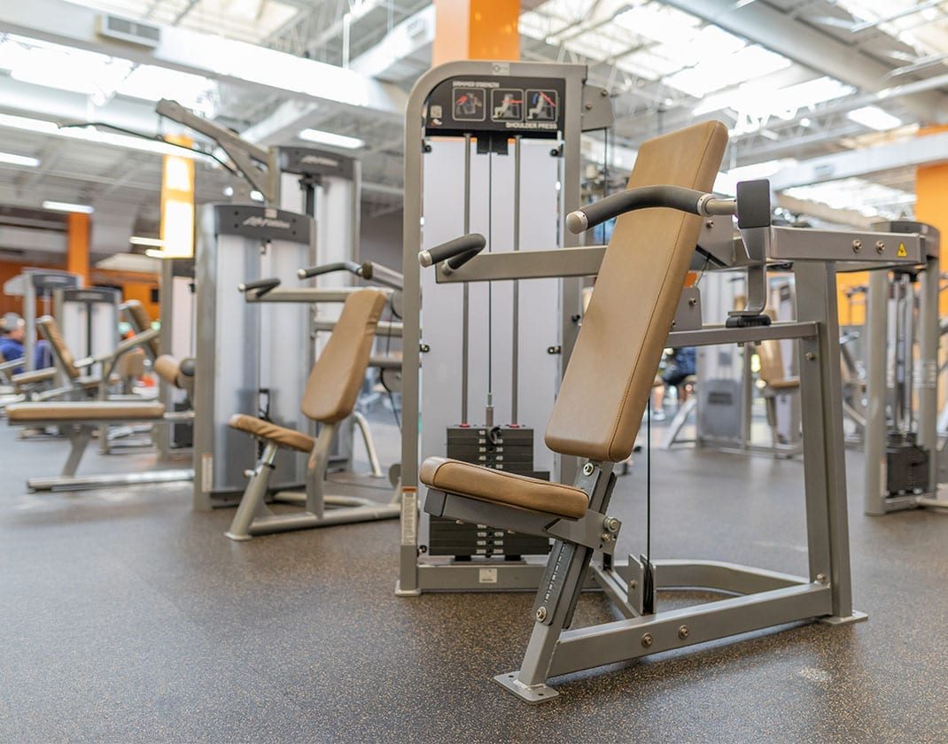 modern exercise equipment in spacious gym