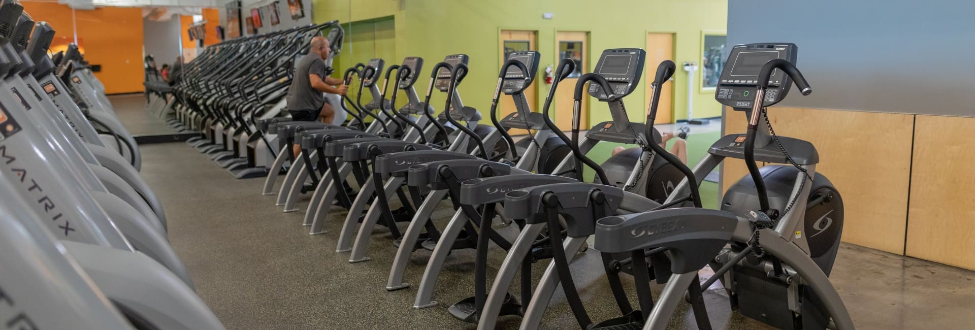 a row of state of the art cardio training equipment at best fitness gym in springfield ma