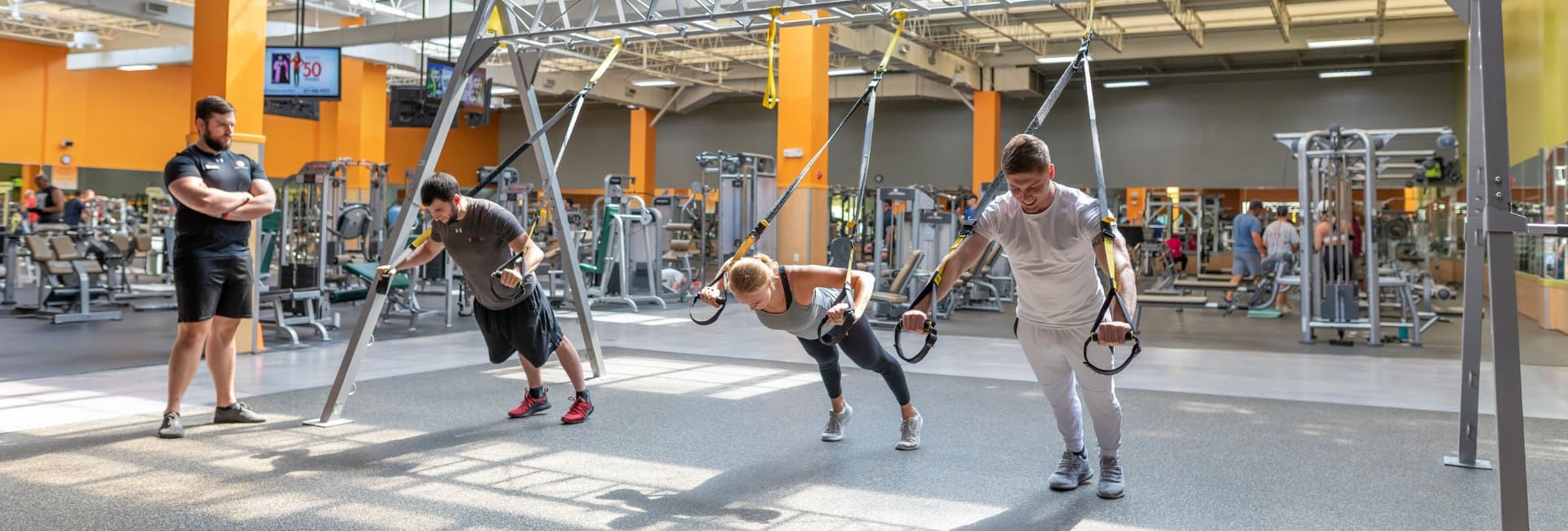 gym members use resistance bands during a personal training session at best fitness gym in springfield