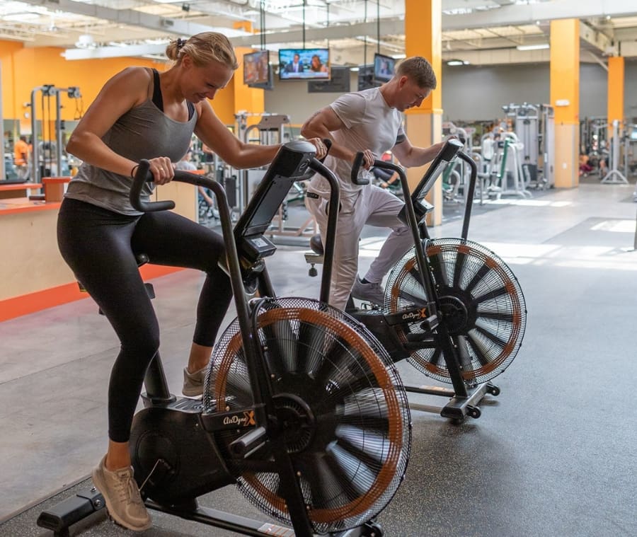 gym members use air bikes during a fitness training session at a gym near me in springfield