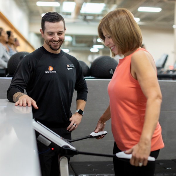 a certified personal trainer helps a gym member with inbody testing at a woburn gym