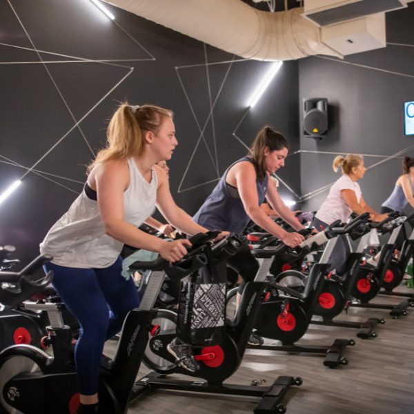 a spinning group fitness class at a woburn gym