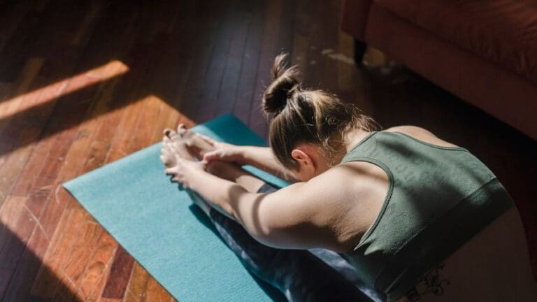 Gym member stretching with yoga