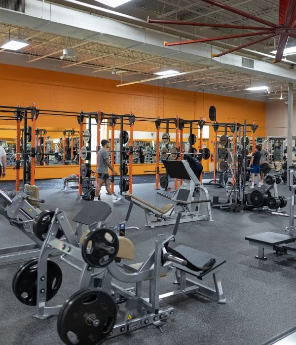 a spacious weight room floor at a modern best fitness gym